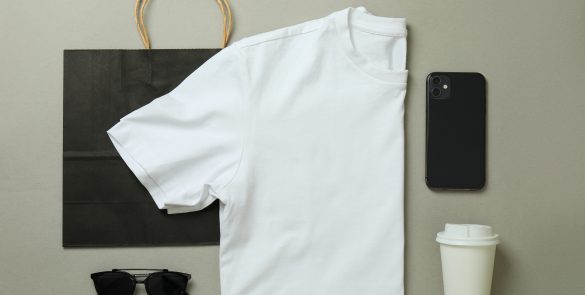 Stylish female wear on light gray background, top view